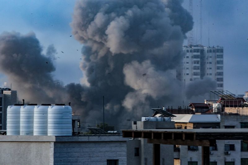 Smoke rising after Israeli airstrikes in Gaza City on Tuesday. Credit Mohammed Saber/EPA, via Shutterstock