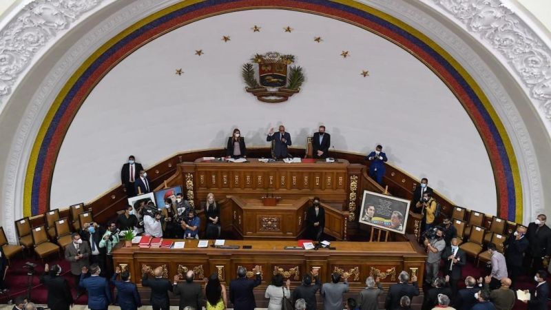The president of the National Assembly, Jorge Rodriguez (C-top) swears in the new authorities of the National Electoral Council (CNE), during a special session at the National Assembly, in Caracas. 4 May 2021. Federico PARRA / AFP