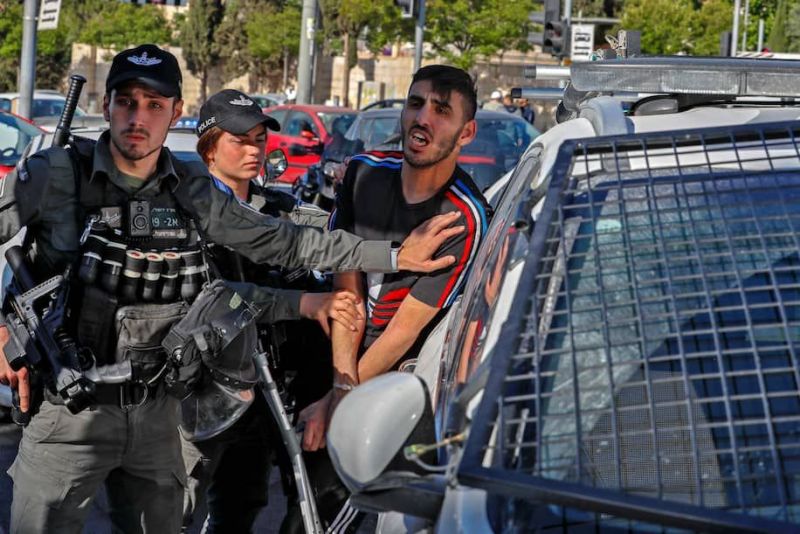 Israeli security forces detain a Palestinian man outside the Damascus Gate in Jerusalem's Old City on Thursday. (Ahmad Gharabli/AFP/Getty Images)