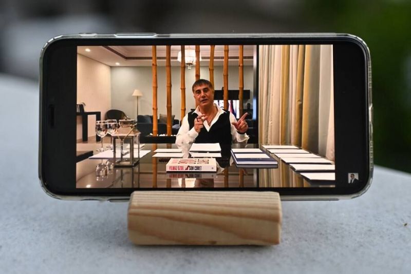 Sedat Peker is seen speaking on his YouTube channel on a cellphone in Istanbul on May 26. (Ozan Kose/AFP/Getty Images)