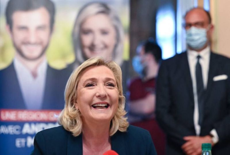 Marine Le Pen, the president of France's far-right National Rally party, speaks at a news conference on Thursday in Saint-Chamond, France. (Philippe Desmazes/AFP/Getty Images)