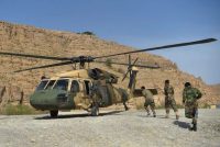 Afghan army soldiers unload a helicopter in Helmand province in March. (Wakil Kohsar/AFP/Getty Images)