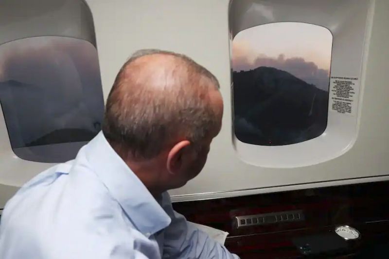 Turkey's President Recep Tayyip Erdogan views wildfires from the air near Marmaris, Turkey, on July 31. (Turkish Presidency via AP) (AP)