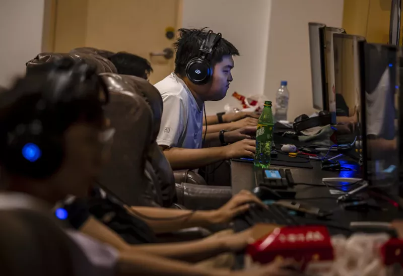 People play games in the video gaming center in Shanghai on Aug. 31. (Alex Plavevski/EPA-EFE/REX/Shutterstock)