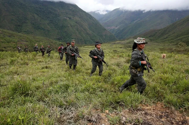 Members of Farc battalion the 51st Front on patrol in the remote mountains of Colombia a month before the accords © John Vizcaino/Reuters