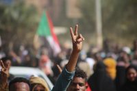 Pro-democracy protesters take to the streets to condemn a takeover by military officials, in Khartoum, Sudan, on Oct. 25. (Ashraf Idris/AP)