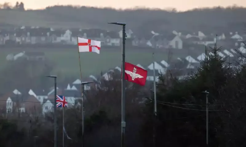 Flags, including that of the Parachute Regiment, flying in Drumahoe, 24 January 2022. Photograph: Liam McBurney/PA