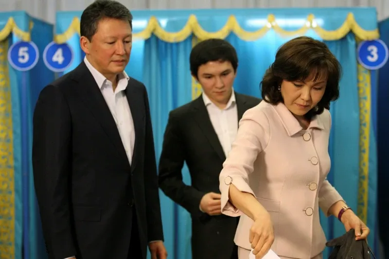 Dinara Kulibayev, daughter of Kazakhstan’s former president Nursultan Nazarbayev, casts her ballot during a presidential election at a polling station in Astana, Kazakhstan, in 2011. She and her husband Timur, left, have each amassed a fortune of $3bn © Nikita Bassov/AP