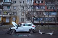 A vehicle damaged by Russian shelling in Mariupol, Ukraine, on Feb. 24. (Sergei Grits/AP)