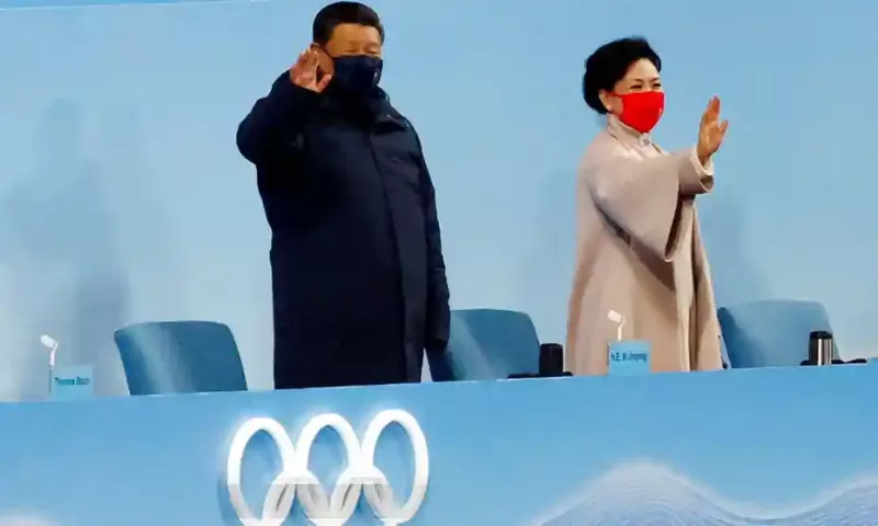 China’s President Xi Jinping waves next to his wife Peng Liyuan at the opening of the Winter Olympics in Beijing on 4 February 2022. Photograph: Evgenia Novozhenina/Reuters