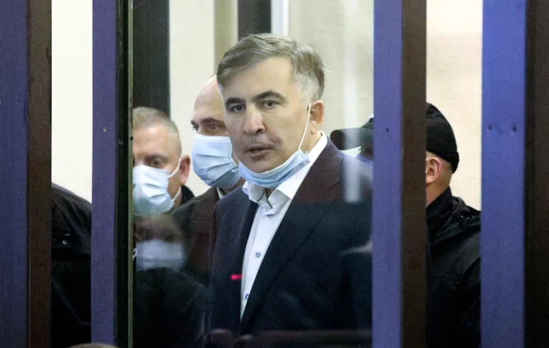 Georgia's jailed opposition leader and ex-president Mikheil Saakashvili in the defendant's box for a hearing at the city court of Tbilisi on Nov. 29. (Irakli Gedenidze/AFP/Getty Images)