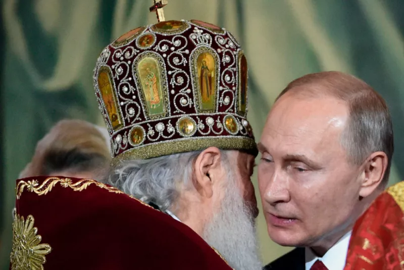 Russian Orthodox Patriarch Kirill (L) congratulates Russian President Vladimir Putin during an Orthodox Easter ceremony in Moscow, early on April 8, 2018. Alexander Nemenov/AFP via Getty Images
