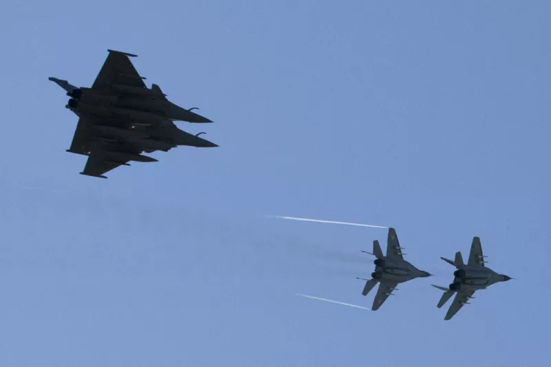  Two French fighter jets (left) and two Polish MiG-29s fly over the air base in Malbork, Poland, on April 29, 2014. Joel Saget/AFP via Getty Images 