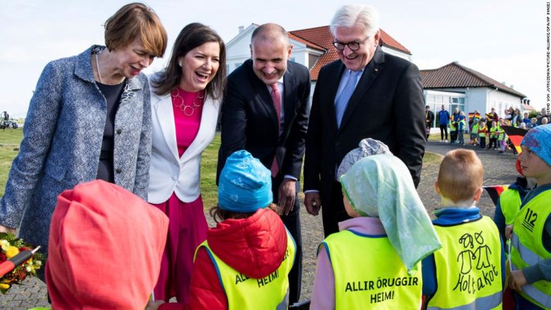 Iceland's First Lady Eliza Reid (second from left) and her husband Iceland's President Guðni Thorlacius Jóhannesson (second from right) greet school children in Reykjavik, in 2019.