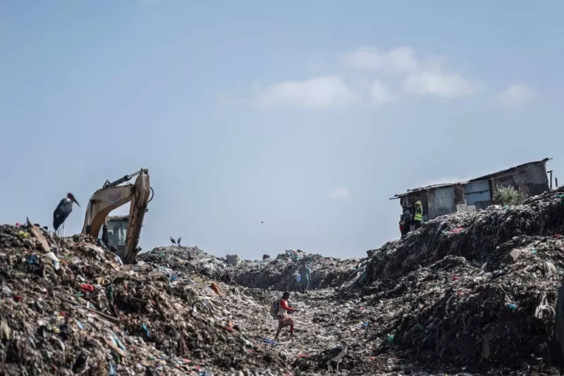  Waste pickers scavenge for items at the Dandora garbage dump in Nairobi on Feb. 26. TONY KARUMBA/AFP via Getty Images 