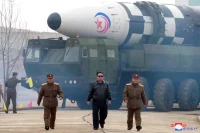 North Korean leader Kim Jong Un walking near a reported intercontinental ballistic missile, North Korea, March 2022. Korean Central News Agency / Reuters