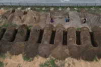 Freshly dug graves at a cemetery in Bucha, Ukraine, last week. Alexey Furman/Getty Images