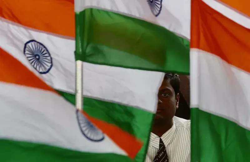 A student holds an Indian flag on Aug. 12 during rehearsals ahead of the 75th Independence Day celebrations in Bangalore. (Jagadeesh Nv/EPA-EFE/Shutterstock) 