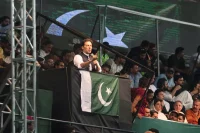 Pakistani opposition leader and former prime minister Imran Khan addresses supporters during a rally to press the government for fresh elections, in Lahore, Pakistan, on Aug. 13. (K.M. Chaudary/AP)