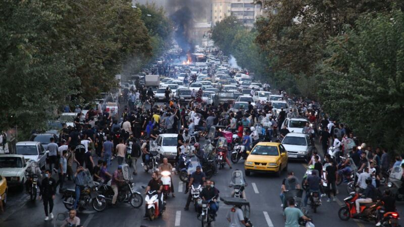 Iranian demonstrators take to the streets of the capital Tehran during a protest for Mahsa Amini, days after she died in police custody, on September 21