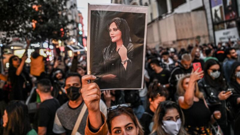 A protester holds a portrait of Iranian woman Mahsa Amini, during a demonstration in Istanbul, Turkey, on September 20.