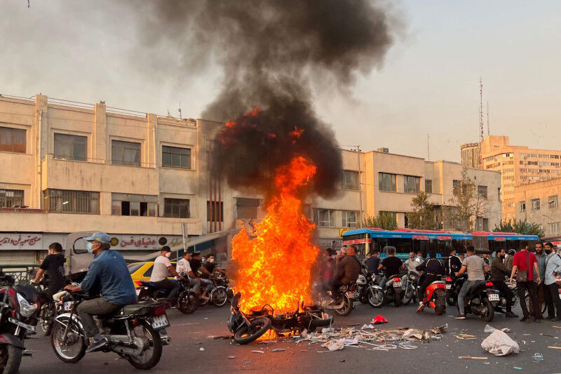 A burning motorcycle in the Iranian capital. The protests after the death of Mahsa Amini have in turn provoked a heavy-handed response from the state © AFP via Getty Images