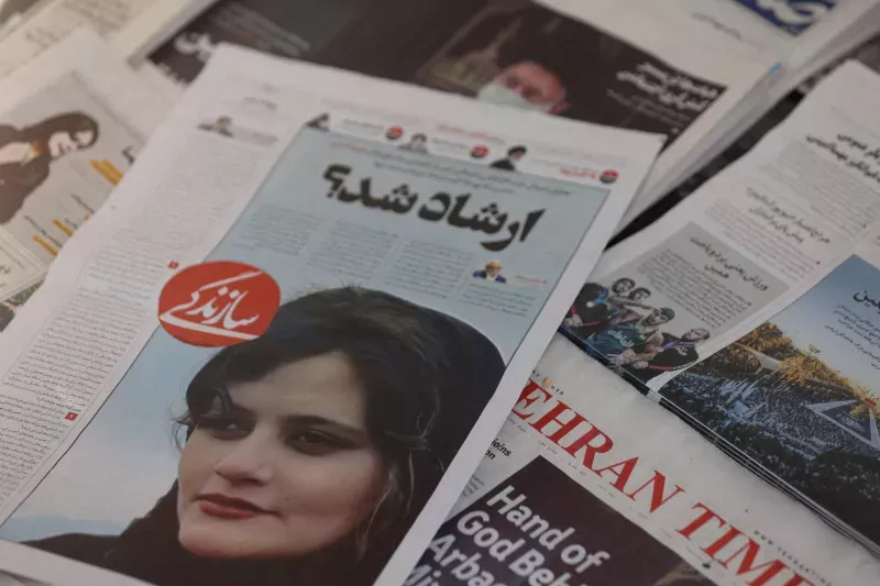 A newspaper features a photo of Mahsa Amini, the 22-year-old who died in police custody last month after allegedly violating the Islamic dress code © Majid Asgaripour/WANAVIA /Reuters