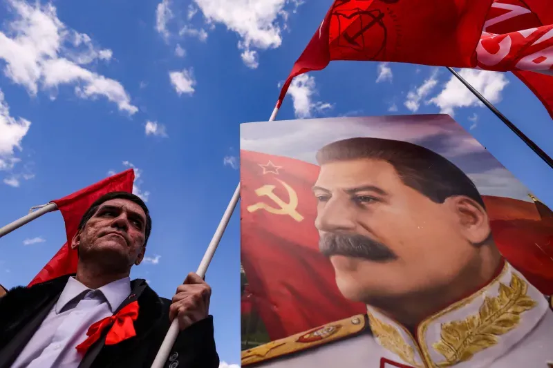  A portrait of Soviet leader Joseph Stalin at a May Day rally, Moscow, Russia, May 2022. Maxim Shemetov / Reuters