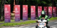 G20 posters and electric motorbike are seen ahead of G20 Summit in Bali, Indonesia on 14 November 2022. Photo by Anton Raharjo/Anadolu Agency via Getty Images.