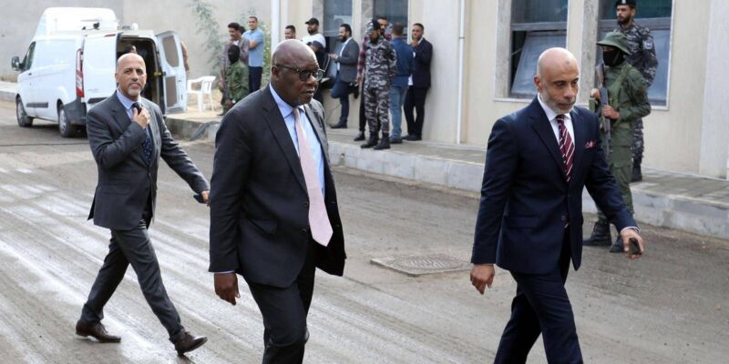 Abdoulaye Bathily (C), UN Special Representative for Libya and Head of the United Nations Support Mission in Libya (UNSMIL), arrives for an election simulation meeting in Tripoli on 5 November 2022. Photo by MAHMUD TURKIA/AFP via Getty Images. 