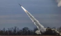 The Ukrainian army fires a HIMARS rocket close to the front in the northern Kherson region on Saturday. (Hannibal Hanschke/EPA-EFE/Shutterstock)
