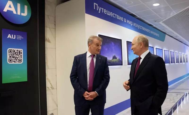 Putin talks with German Gref, CEO and chairman of the Executive Board of Sberbank at the Artificial Intelligence Journey international conference in Moscow. (Sputnik/via REUTERS)