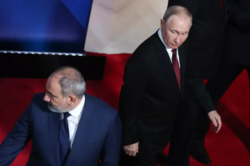 Putin, right, and Armenian Prime Minister Nikol Pashinyan leave the podium after posing for a photo on Nov. 23. (Vahram Baghdasaryan/AP)