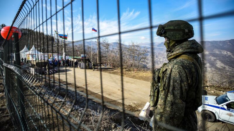 A Russian peacekeeper guards the Lachin Corridor, which has been blocked by Azerbaijani protesters since December 12, 2022 -- cutting off ethnic Armenians of Nagorno-Karabakh from the outside world. Tofik Babayev/AFP/Getty Images