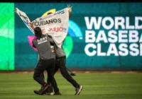 A protester against the Cuban government runs on the field during the 2023 World Baseball Classic game between the United States and Cuba in Miami on March 19. (Cristobal Herrera-Ulashkevich/EPA-EFE/Shutterstock)