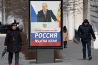 A banner of Russian President Vladimir Putin in Sevastopol, Crimea, March 2023. Alexey Pavlishak / Reuters