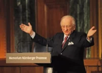 Benjamin Ferencz speaks at the opening of an information and documentation centre in Nuremberg on 21 November 2010. At 90 years of age, he has become an icon of international justice. © Armin Weigel / Pool / AFP