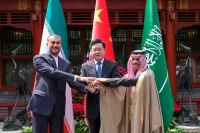 Iranian Foreign Minister Hossein Amirabdollahian, left, is shown with his Saudi counterpart, Prince Faisal bin Farhan al-Saud, right, and Chinese counterpart, Qin Gang, in Beijing on April 6. (Ding Lin/AP)