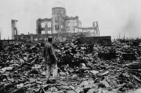 A man stands amid the ruins of Hiroshima, Japan, after the United States dropped an atomic bomb, killing tens of thousands of civilians, on Aug. 6, 1945. AP