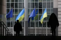 Ukrainian flags in front of the EU parliament building, Brussels, Belgium, February 2023. Yves Herman / Reuters.
