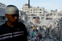 Palestinians searching for casualties in Khan Younis, Gaza Strip, October 2023. Ibraheem Abu Mustafa / Reuters