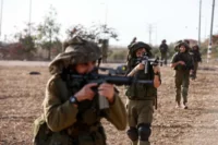 Israeli soldiers near the Gazan-Israeli border, October 2023. Amir Cohen / Reuters