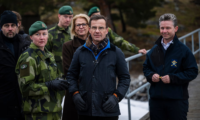 Swedish prime minister Ulf Kristersson watches a military demonstration on 20 February 2024 at Berga naval base. Photograph: Jonathan Nackstrand/AFP/Getty Images