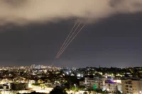 An antimissile system firing as seen from Ashkelon, Israel, on Saturday night after Iran launched drones and missiles toward Israel. (Amir Cohen/Reuters)