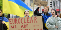 Ukrainians demonstrate in front of the Belgium-based financial services company Euroclear to advocate seizure of frozen assets of the Central Bank of the Russian Federation on April 11, 2024 (Photo by Thierry Monasse/Getty Images)